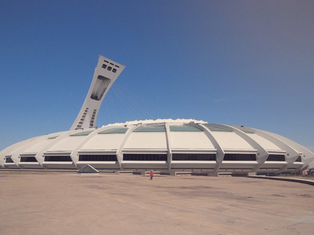 The stadium and its leaning tower, still paying for itself in patience. Photo: Harrystyle, CC BY 3.0, via Wikimedia Commons.